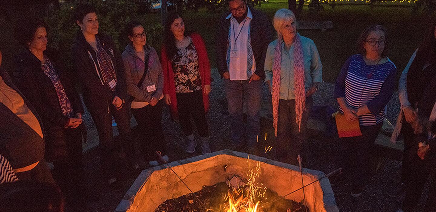 A group standing around a fire
