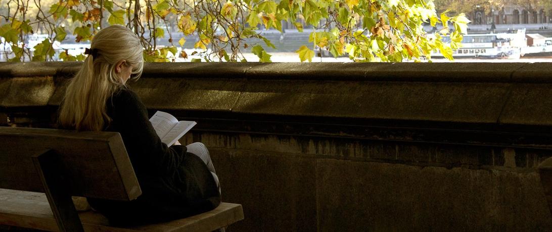 Woman reading on a bench