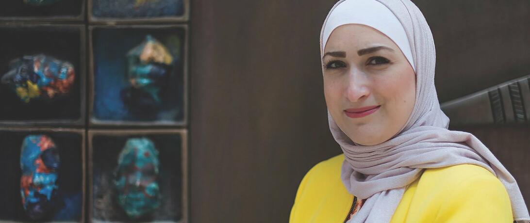 woman in hijab and yellow shirt