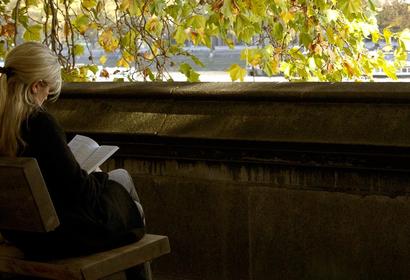 Woman reading on a bench