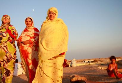 Women walk at the refugee camp near Tindouf, Algeria. 