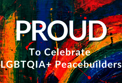 Large, colorful image of the word "PROUD"
